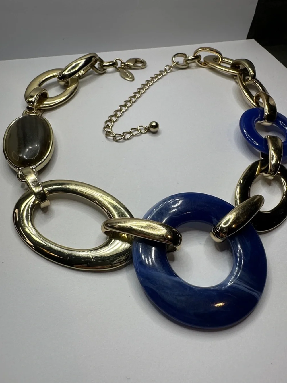 Chico's Gold-Tone Link Necklace with Deep Blue Swirled Lucite Rings - Picture 3 of 5